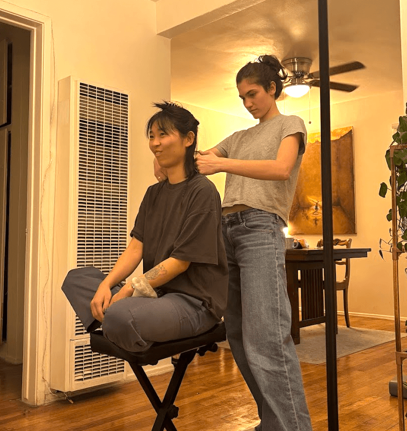 mei getting her hair cut in our living room, two rattails